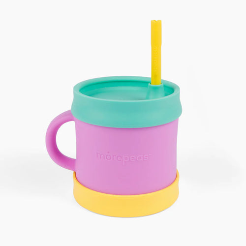 Essential sippy cup by morepeas kids in food grade silicon with removeable straw and spout lid. Yellow color base, purple cup, teal lid, and yellow straw. 