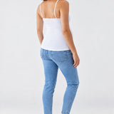 Back view of Ingrid & Isabel Cooling Maternity Layering Cami in white on a pregnant model.