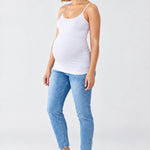 Front view of Ingrid & Isabel Cooling Maternity Layering Cami in white on a pregnant model.