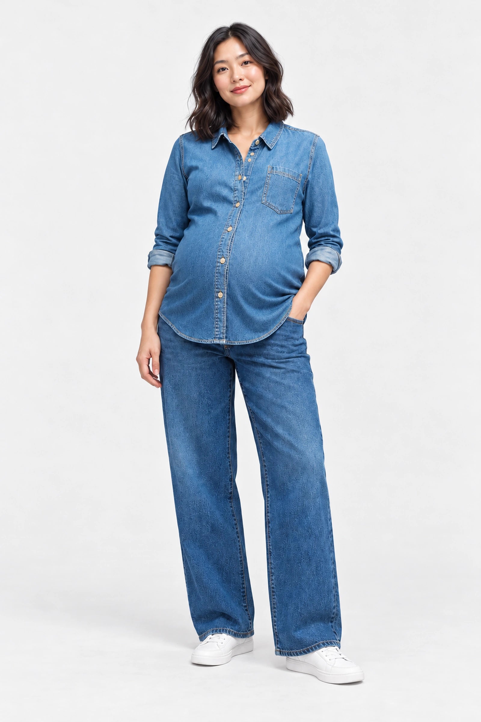Front view of Ingrid & Isabel Relaxed Denim Maternity + Nursing Shirt in medium wash on a pregnant model.
