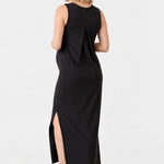 Back view of Ingrid & Isabel The Sidekick Maternity Column Dress in black on a pregnant model.