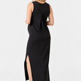 Back view of Ingrid & Isabel The Sidekick Maternity Column Dress in black on a pregnant model.