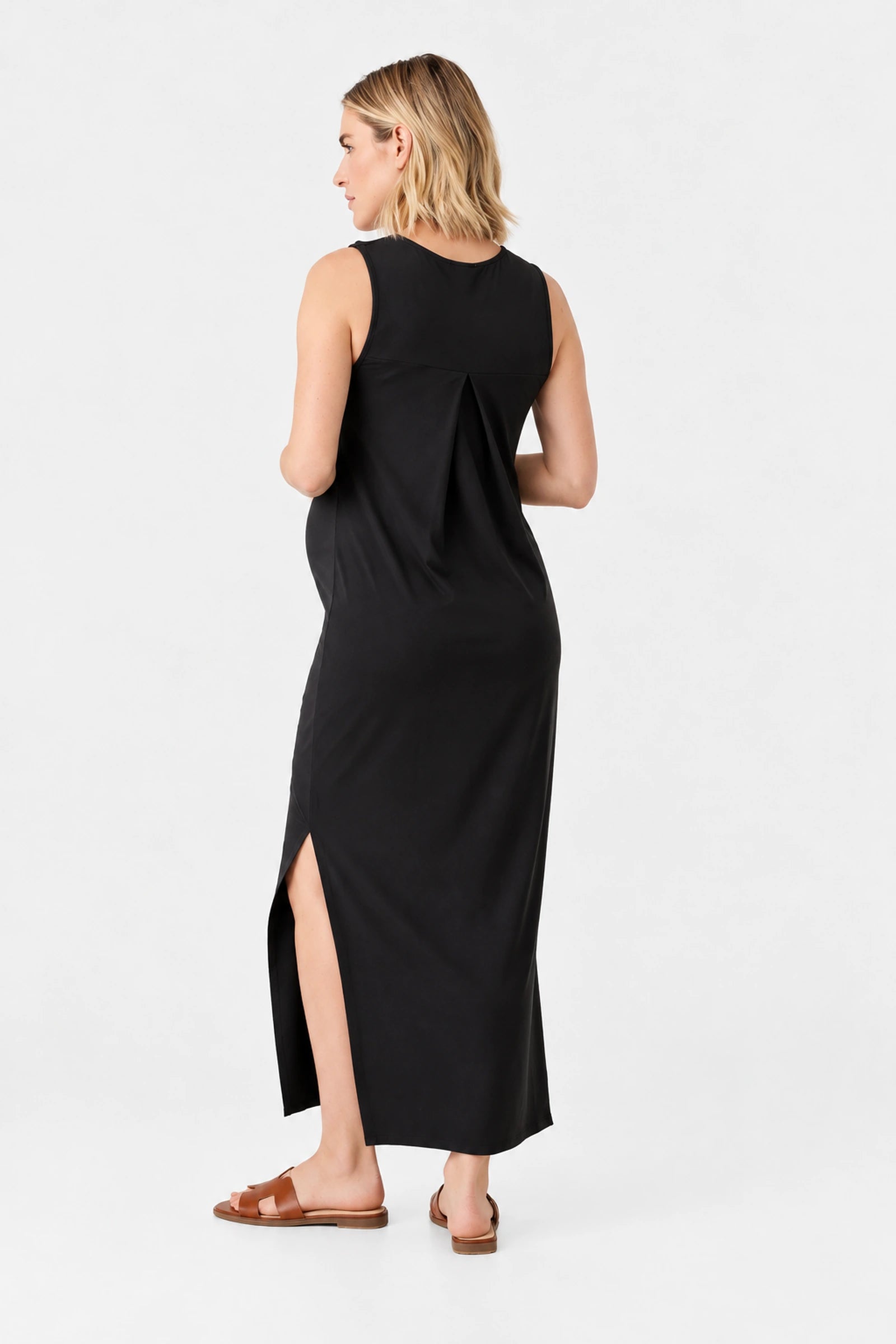 Back view of Ingrid & Isabel The Sidekick Maternity Column Dress in black on a pregnant model.