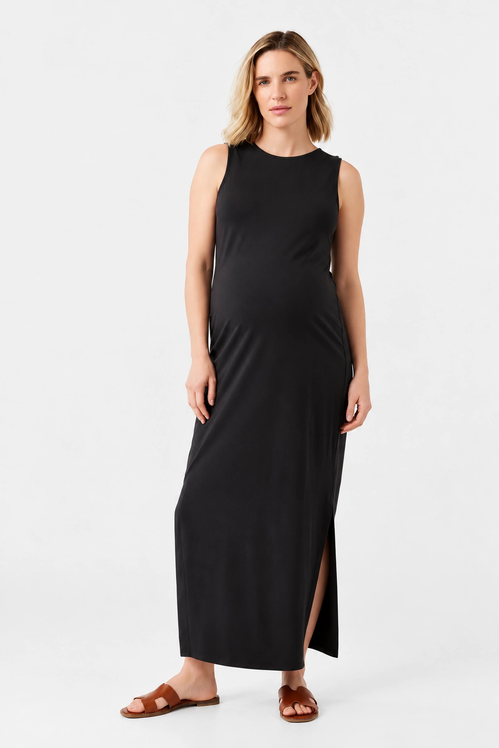 Front view of Ingrid & Isabel The Sidekick Maternity Column Dress in black on a pregnant model.