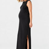 Side view of Ingrid & Isabel The Sidekick Maternity Column Dress in black on a pregnant model.