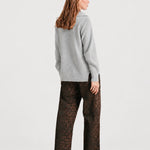 Back view of NOM Slouch Under-Bump Relaxed Jeans — Leopard Print
