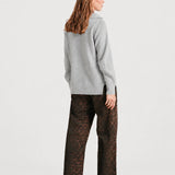 Back view of NOM Slouch Under-Bump Relaxed Jeans — Leopard Print