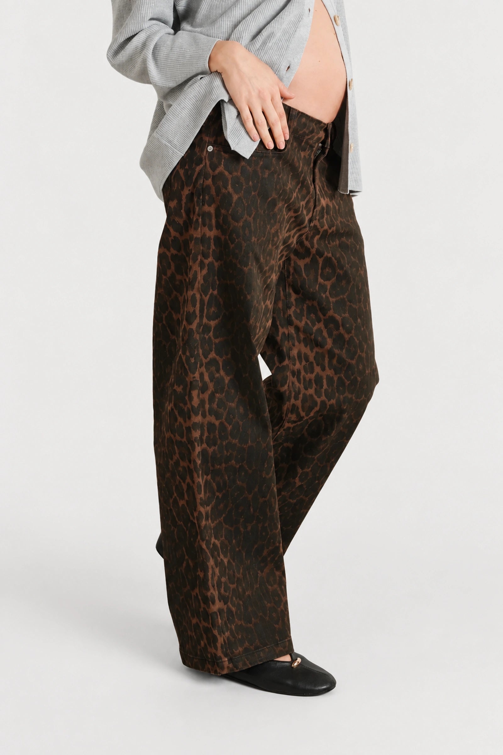 Detail view of NOM Slouch Under-Bump Relaxed Jeans — Leopard Print