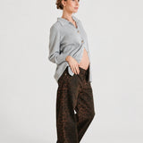 Front view of NOM Slouch Under-Bump Relaxed Jeans — Leopard Print