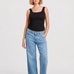 Front view of NOM Slouch Under-Bump Relaxed Jeans — Light Wash