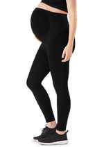 Belly Bandit Bump support legging in black with high waist and  fabric ribbing to provide support to the stomach during pregnancy