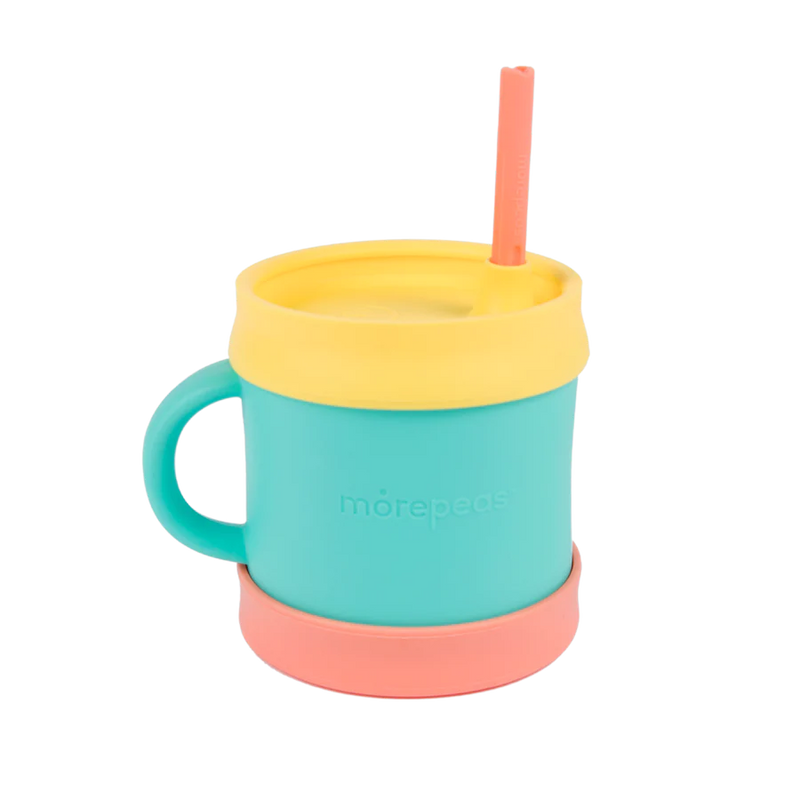 Esential sippy cup for toddlers and children in food grade silicon. With straw that can be tucked in lid. Poppy color base, Teal cup, Yellow lid, poppy straw. 
