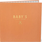 Detail shot showing Baby's First Year Memory book standing up with interior lining of repeating bear patterns showing 